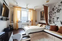 Interior of a room in a one-room apartment with a bed photo