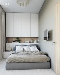 Photo of a small bedroom with a bed and wardrobe design