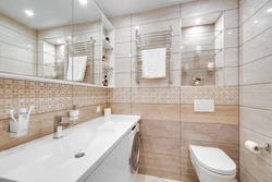 Bathroom design with toilet tiles in light colors