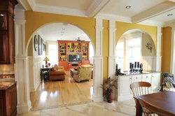 Kitchen with an arch to the living room in the apartment photo