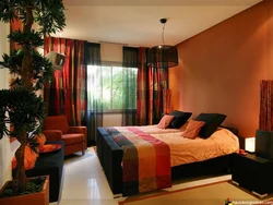 Orange wallpaper in the bedroom interior