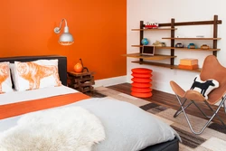 Orange wallpaper in the bedroom interior