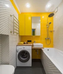 Design of a small bathroom with a washing machine and toilet photo