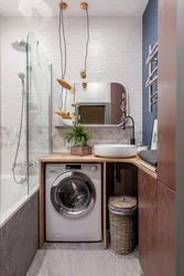 Design Of A Small Bathroom With A Washing Machine And Toilet Photo