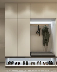 Wardrobe in the hallway with a shoe rack in a modern style photo