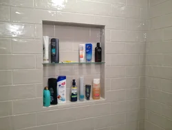 Niche In The Bathroom For Shampoos Made Of Tiles Photo