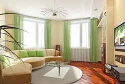 Design of a living room with a corner window in an apartment