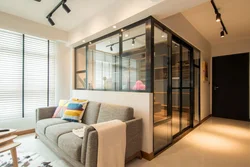 Glass partition in the living room interior