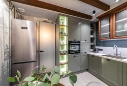 Kitchen design along one wall with a refrigerator photo