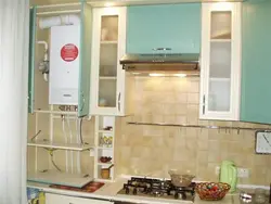 How to cover pipes in the kitchen with a kitchen set photo