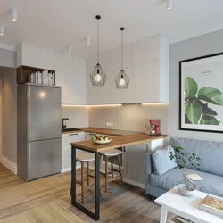 Design of a one-room studio apartment with a kitchen
