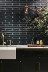 Kitchens with black tiles on the wall photo