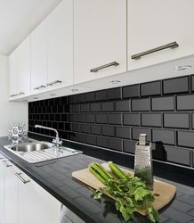 Kitchens with black tiles on the wall photo