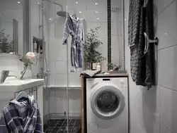 Bathroom design photo with shower, washing machine, toilet