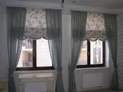 Curtains up to the window sill in the living room in a modern interior
