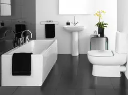 White bathroom design with one black wall