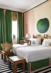 Green color of curtains in the bedroom interior