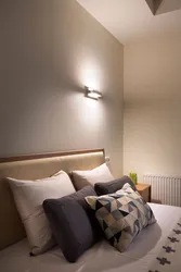 Modern wall lamps for the bedroom above the bed photo