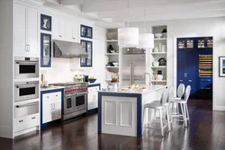 Photo of white kitchen and household