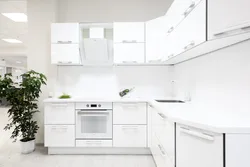 Photo of white kitchen and household