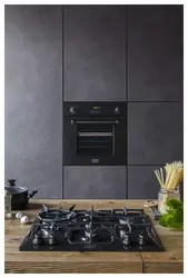 Черные духовые шкафы в интерьере кухни