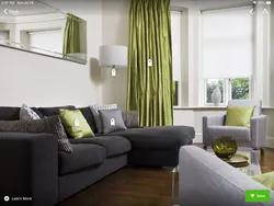 Green curtains in the living room interior with beige wallpaper