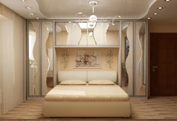 Wardrobes in a small bedroom design photo