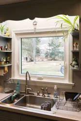Window from the bathtub to the kitchen photo