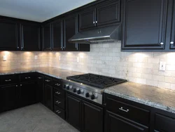 Black apron for the kitchen in the kitchen interior photo