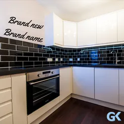 Black apron for the kitchen in the kitchen interior photo