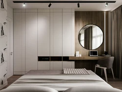 Bedroom design with mirror on the wall