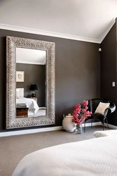 Bedroom design with mirror on the wall