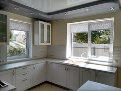 Kitchen in a country house with a window in the middle photo