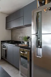 Gray refrigerator in the kitchen interior photo