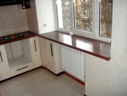 Kitchen combined with window sill photo