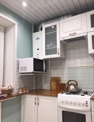 Kitchens in Khrushchev with a gas water heater and a refrigerator design