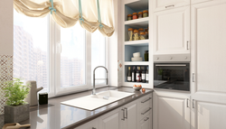 Kitchen interior by the window in the apartment