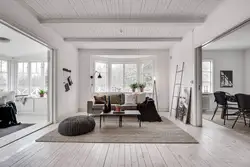 White living room with wood in the interior
