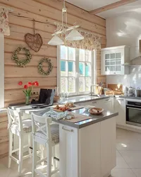 Small kitchen in a wooden house photo