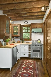 Small kitchen in a wooden house photo