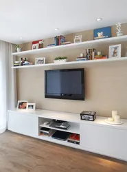 Shelf design above the TV in the living room photo