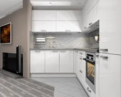 Kitchen With A Gray Countertop In A White Interior And An Apron