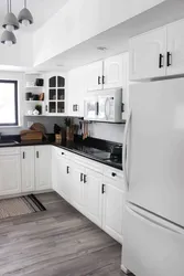 White Kitchen Design With Black Handles