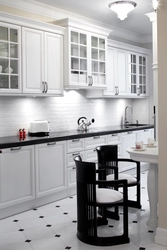 White kitchen design with black handles