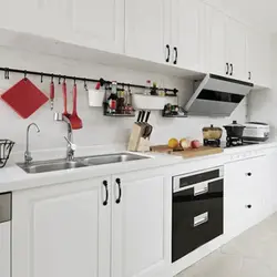 White kitchen design with black handles