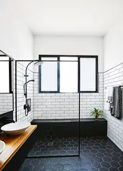 Bathroom design with dark shower