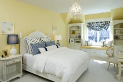 Yellow wall color in the bedroom interior