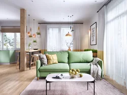 Зеленый диван в интерьере кухни гостиной