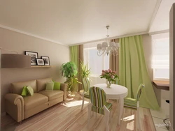 Зеленый диван в интерьере кухни гостиной