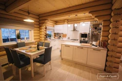 Photo of a kitchen made of rounded logs
